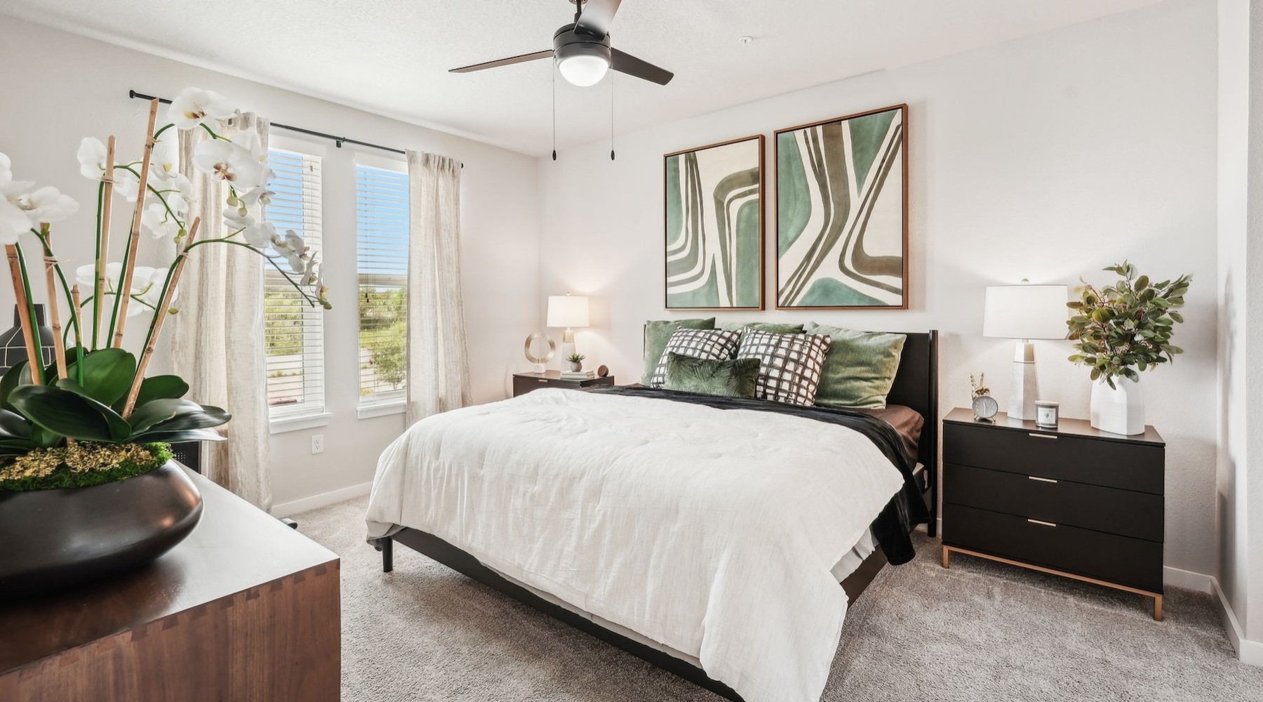a bedroom with a bed and two nightstands