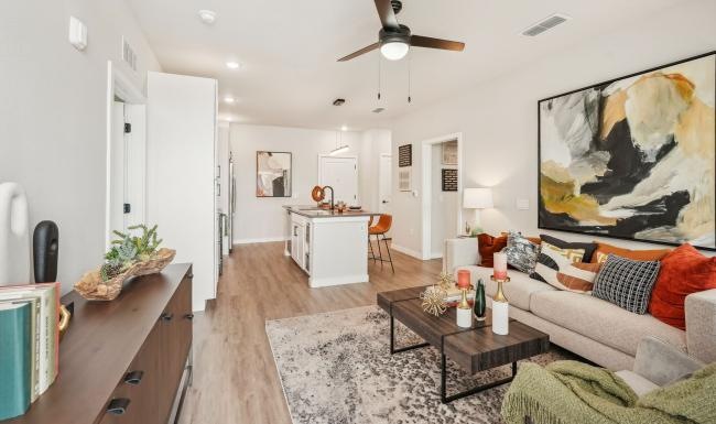 a living room with a couch and a table