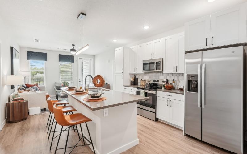 a kitchen with white cabinets